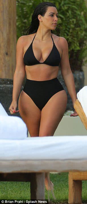 Kim Kardashian Cools Off In See Through Bathing Suit In Photos From