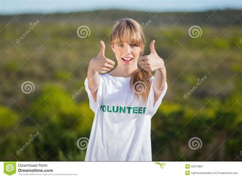Natural Blonde Wearing A Volunteering T Shirt Giving Thumbs Up Stock