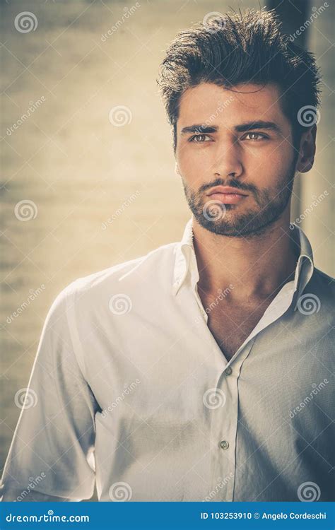 handsome young man portrait intense   eye catching beauty stock