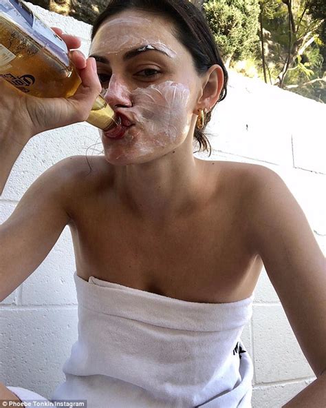 Phoebe Tonkin Sips Beer While Wearing A Face Mask Before