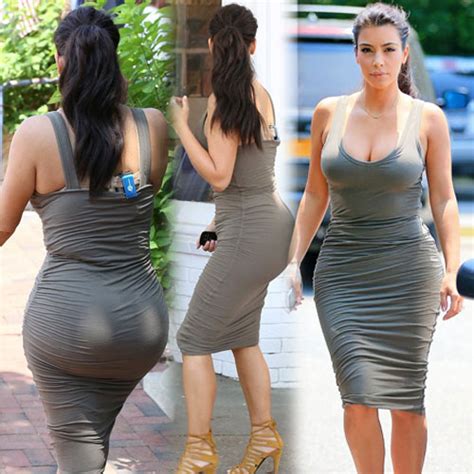 kim s exposing cleavage in skintight frock slide 1