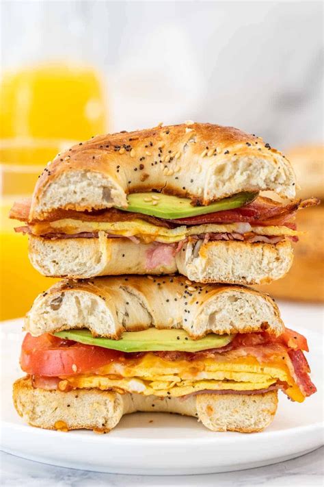 delicious breakfast bagel sandwich   stacked  eggs cheese