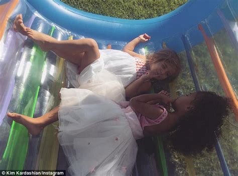 kim kardashian shares snap of penelope playing with north daily mail online