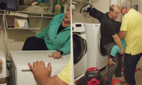 woman gets trapped behind dryer while installing it daily mail online