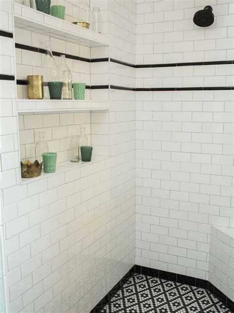 white subway tile  black stripe shower inspiration  shelves