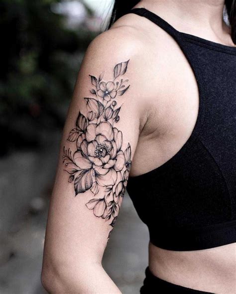 A Black Floral Piece On The Right Upper Arm Tattoos For Women Half