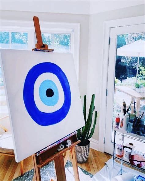 easel   blue  white painting    front   window