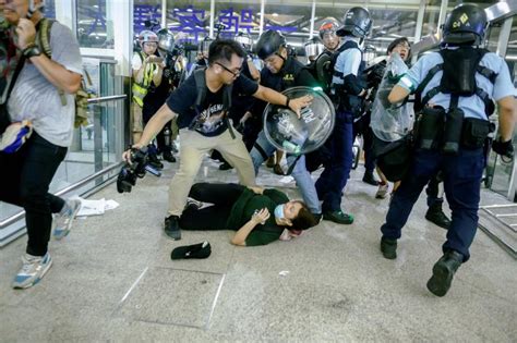 protesters and police clash at hong kong airport amid ongoing unrest sojourners