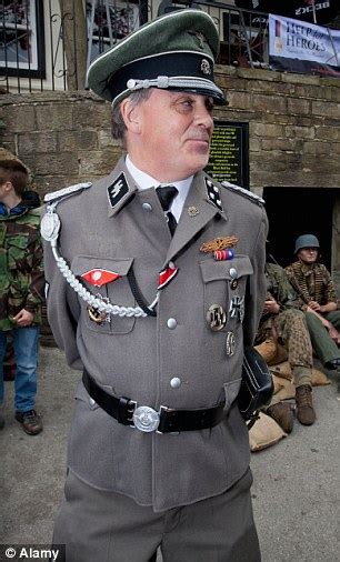 German Delegation Greeted By Revellers In Nazi Uniforms On Visit To
