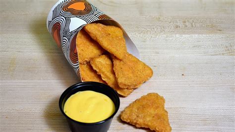 taco bell s naked chicken chips are available again inside cheesy new