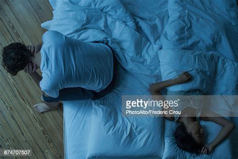 Man Unable To Sleep While Wife Sleeps Comfortably Unaware Photo Getty