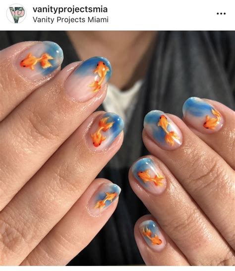 hands  manies decorated  goldfishs  blue sky