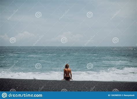 woman sit on tropical beach black sand nacked stock image image of
