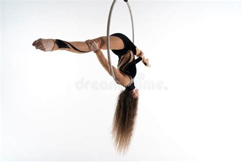 flexible girl circus artist in aerial hoop on white background