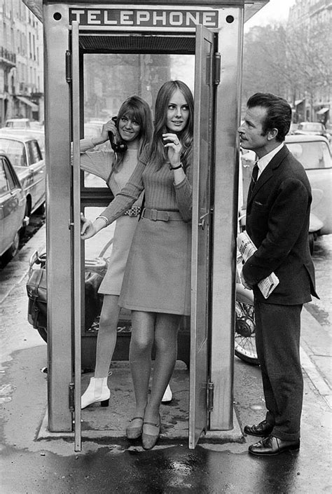 women   man  standing   public phone booth