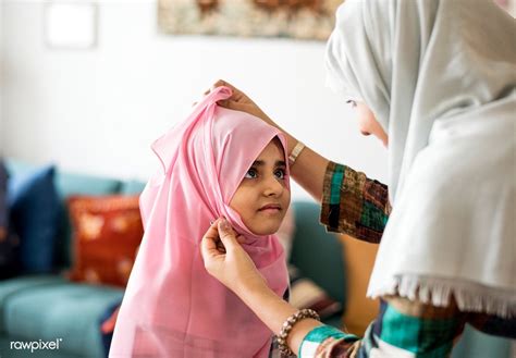 Muslim Mom Teaching Daughter How To Wear A Hijab Premium Image By