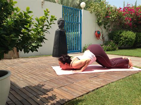 knees chest chin  images outdoor yoga pilates