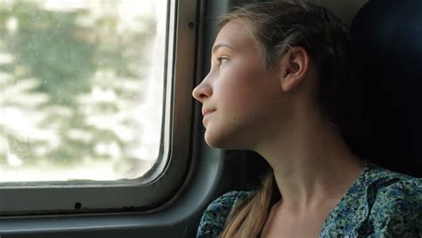 teenage girl looking through window stock footage video