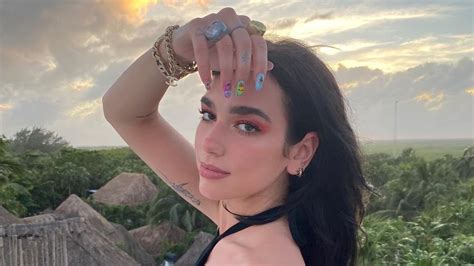 Dua Lipa Gives Her Dress A Saucy Twist With An Exposed