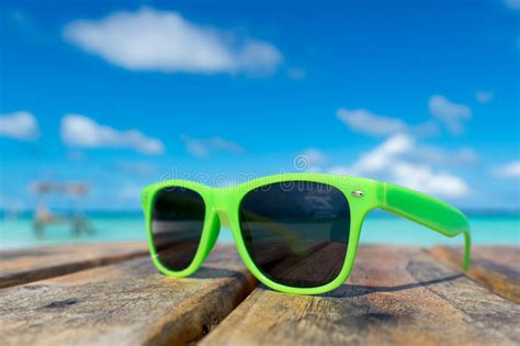 Picture Of Sunglasses On The Tropical Beach Vacation Traveler Stock