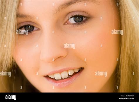 close up of face of very pretty 16 18 year old blonde girl with blue