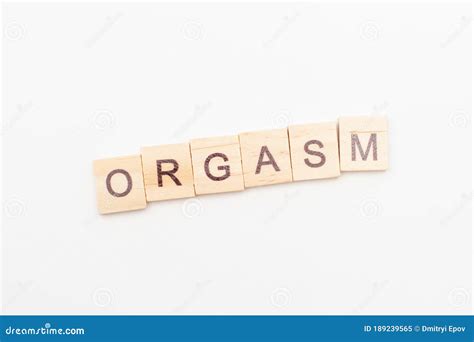 inscription orgasm made of letters on wooden blocks sex education