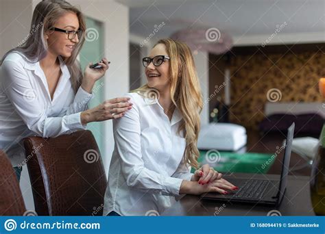 Young White Collar Lesbian Businesswomen Couple Business Patners Stock