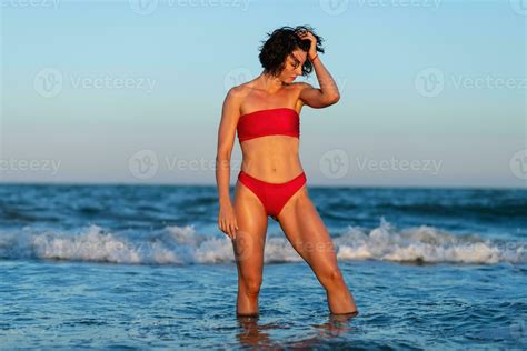 Sexy Back Of A Beautiful Woman In Red Bikini On Sea Background 34201081