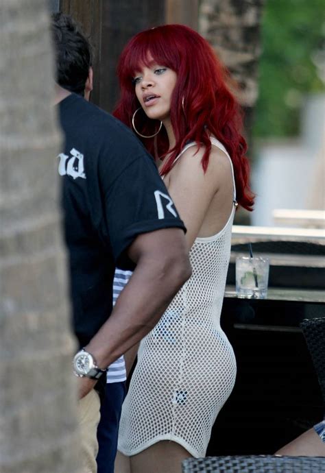 rihanna topless in a grid and clutches her crotch on a