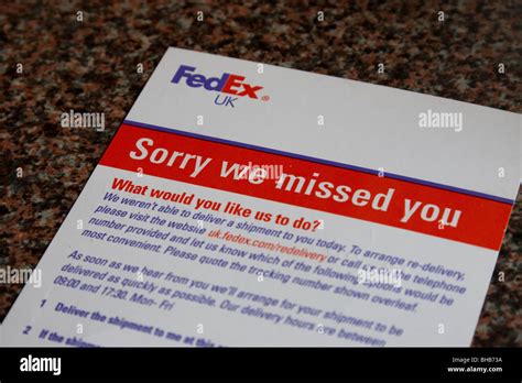 fedex delivery notice left   parcel  package    delivered england uk stock