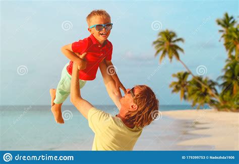 Father And Son Playing On Summer Tropical Beach Stock