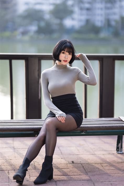 1419168 Asian Brunette Girl Bench Sitting Legs Stilettos Skirt