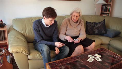 stock video of grandson and grandmother playing cards