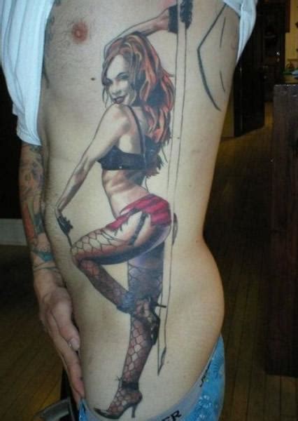 this sexy pinup tattoo shows a stripper dancing ratta tattoo