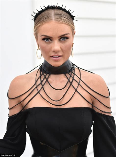 elyse knowles shows off very tiny waist in corset at derby