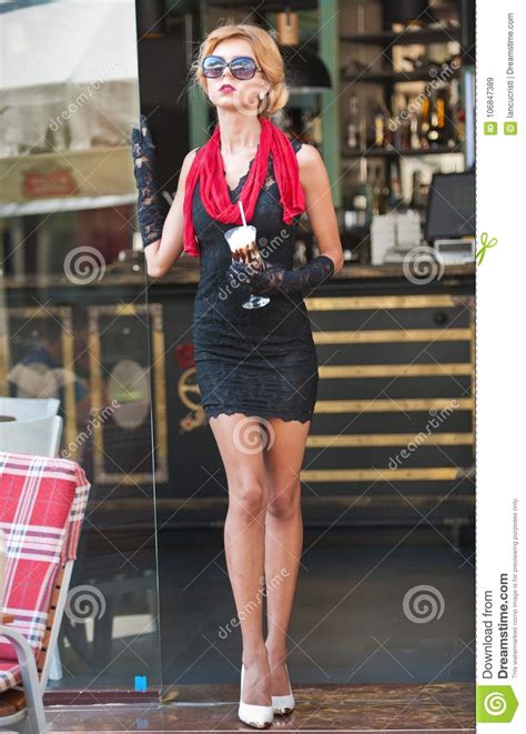 Fashionable Lady With Short Black Lace Dress And Red Scarf And High