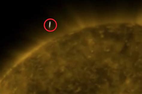 alien news shocking clip shows cigar shaped object hovering above sun