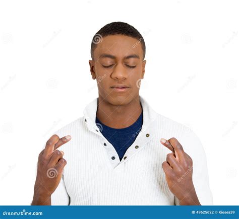 man crossing fingers wishing hoping   miracle stock photo