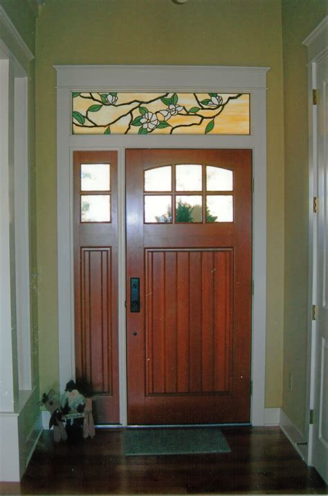 custom stained glass window above a door magnolia design created by