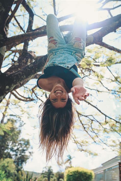 photo  woman hanging   tree upside   stock photo