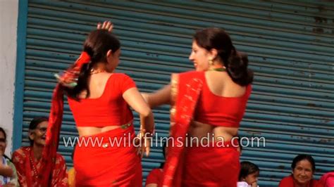 nepali women in red sarees dance at dakshinkali in bagmati on teej