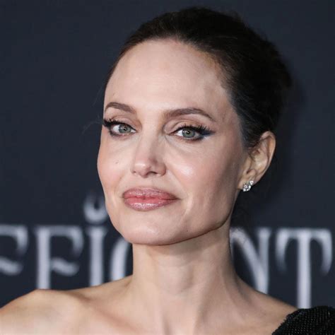 angelina jolie steps    high slit black dress  dinner   york