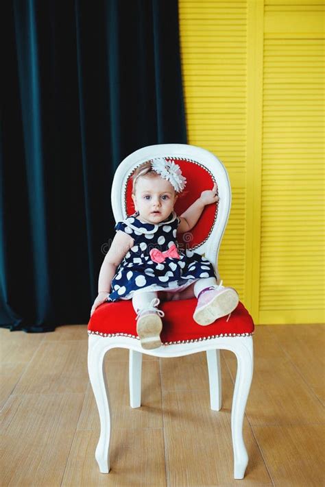 pretty  girl  sitting   chair stock image image