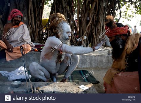 A Sadhu Holy Man Is Blessing A Follower At The Kumbh Mela