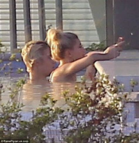 Justin Bieber Soaks Up Sun In His Pool With Bikini Clad