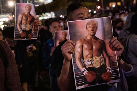 signs held   shirtless champion trump  people  hong kong fight  freedom