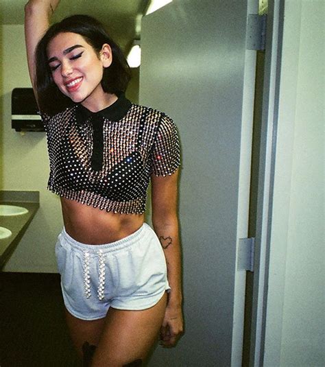 dua lipa shows off her cheeky side in booty baring hot pants after