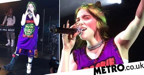 billie eilish won t let injuries stop her fun as she performs in leg