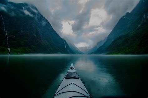landscape nature kayaks fjord mountain mist clouds creeks norway morning blue rain