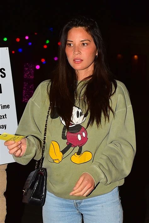 olivia munn cute in mickey mouse sweatshirt and jeans out